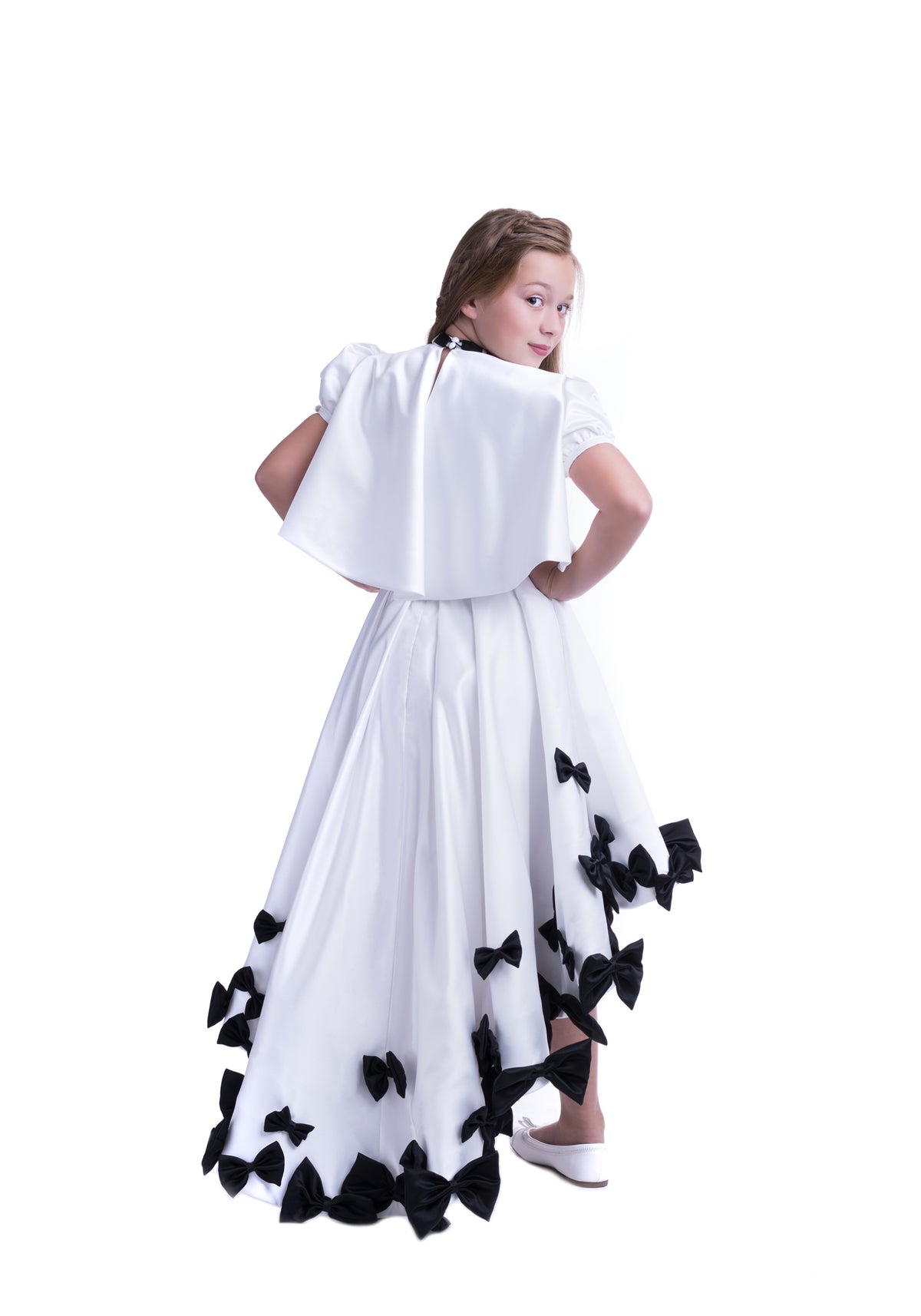 Elegant white dress with black bows