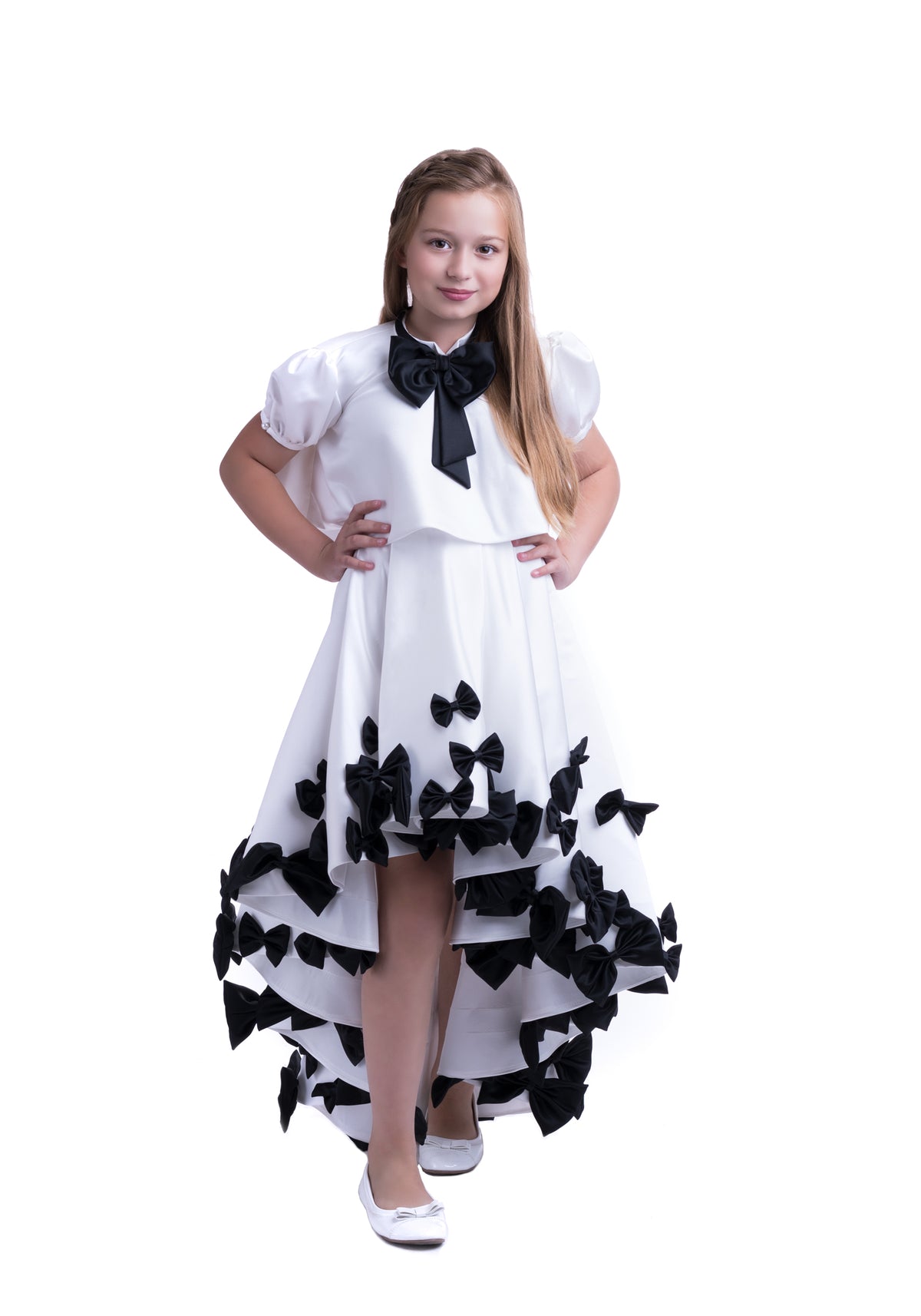 Elegant white dress with black bows