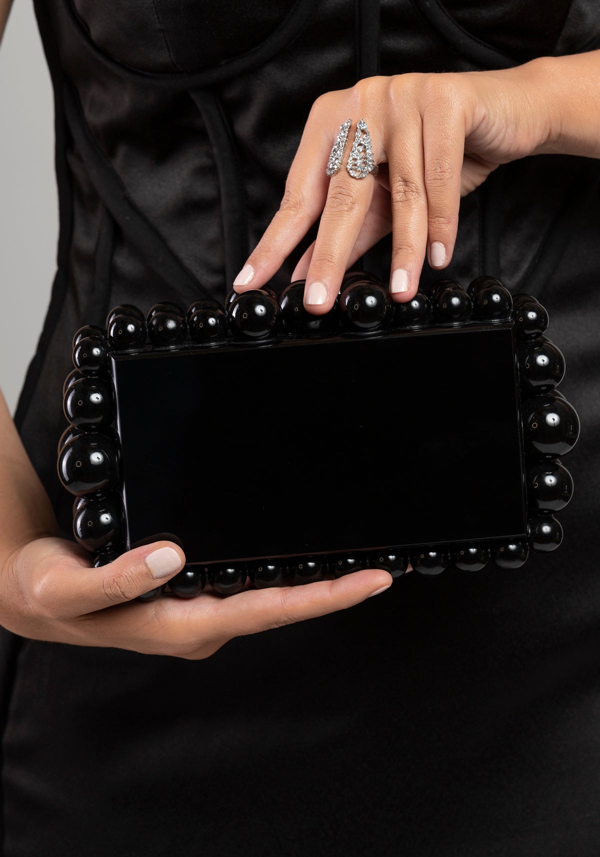 Black beads glossy handbag